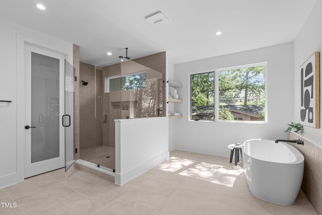 full bath featuring a soaking tub, a shower stall, visible vents, and recessed lighting