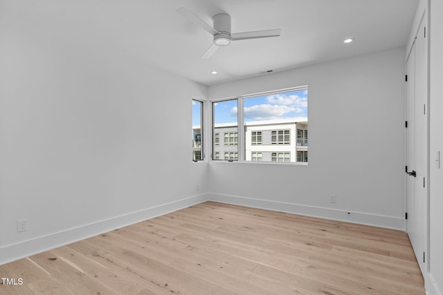 unfurnished room with ceiling fan, recessed lighting, light wood-style flooring, and baseboards