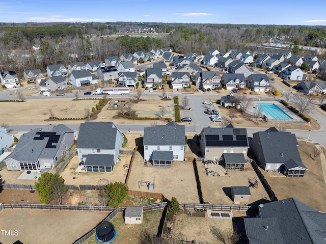 birds eye view of property with a residential view