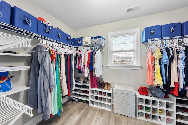 spacious closet with wood finished floors and visible vents