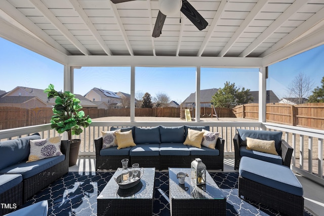 view of patio / terrace with a ceiling fan, a residential view, outdoor lounge area, and a fenced backyard