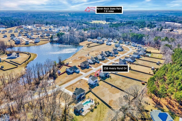 bird's eye view featuring a water view and a residential view