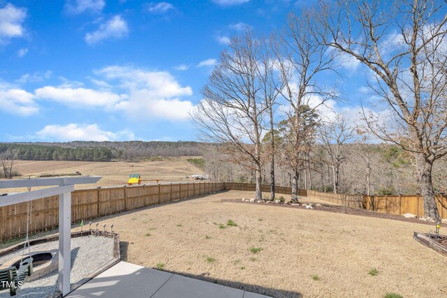 view of yard with a fenced backyard