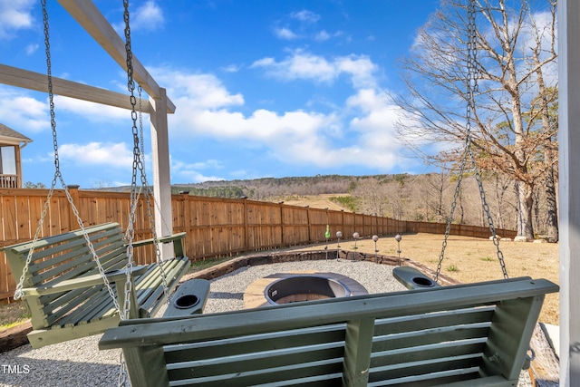 view of yard featuring an outdoor fire pit and a fenced backyard