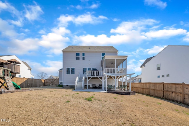 rear view of house featuring a lawn, ceiling fan, a fenced backyard, a patio area, and a playground