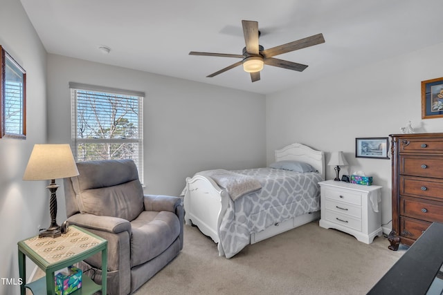 bedroom with light carpet and a ceiling fan