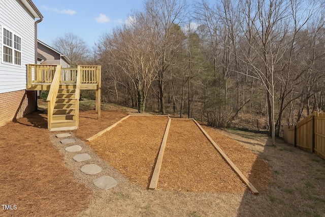 4319 White Cliff Ln, Durham, NC 27712 - view of yard with fence, a wooden deck, and stairs