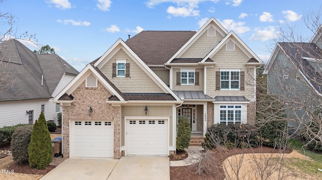 craftsman house featuring a garage, concrete driveway, a shingled roof, and a standing seam roof