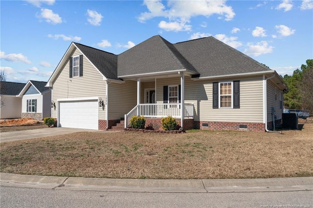 view of front facade with driveway, crawl space, a porch, and a front yard