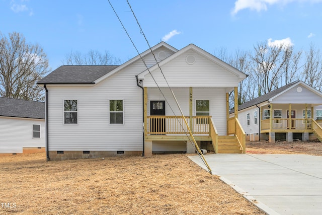 view of front of house with a porch, crawl space, and a shingled roof