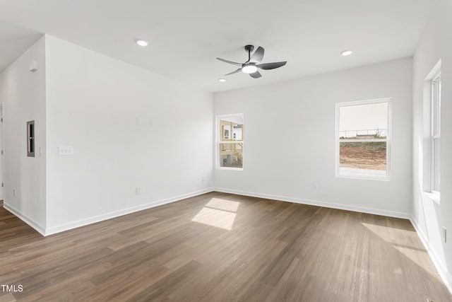 unfurnished room with recessed lighting, dark wood finished floors, baseboards, and ceiling fan