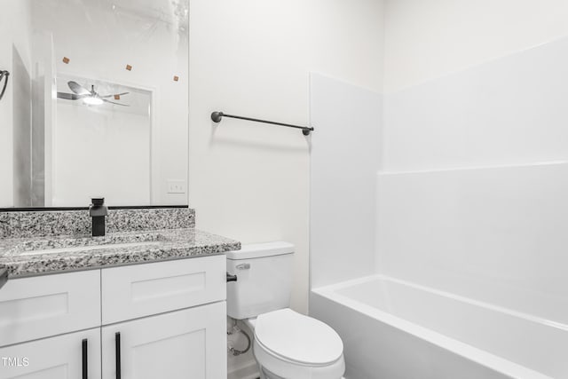 bathroom featuring toilet,  shower combination, and vanity