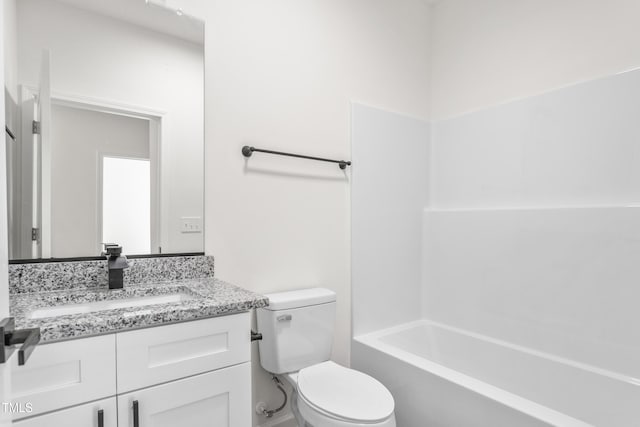 bathroom with shower / tub combination, vanity, and toilet