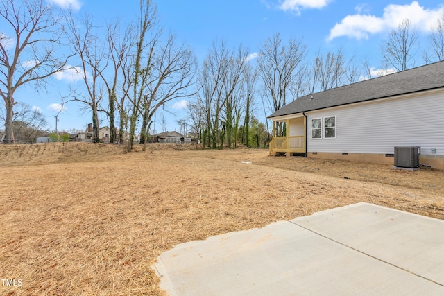 view of yard featuring a patio area and central AC