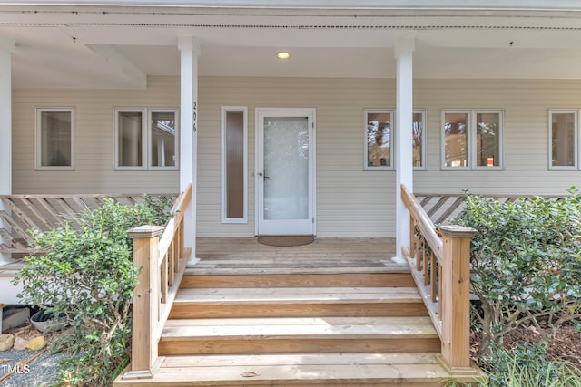 doorway to property with a porch