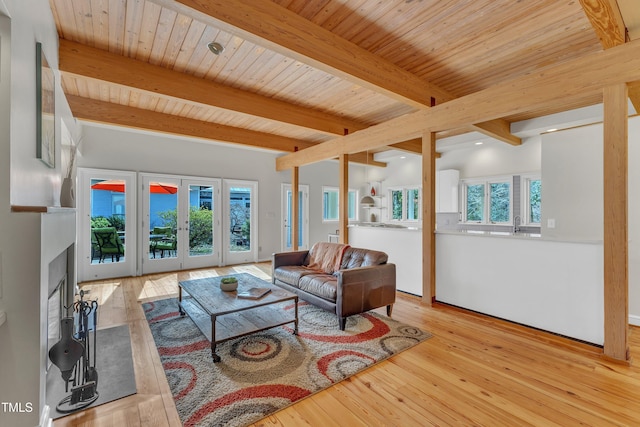 living room featuring wood ceiling, french doors, beam ceiling, and hardwood / wood-style flooring