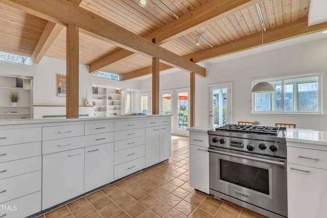 kitchen with wood ceiling, light countertops, stainless steel range, and beamed ceiling