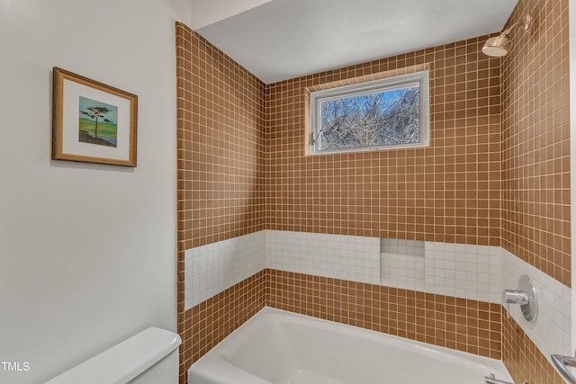 bathroom with toilet and shower / washtub combination