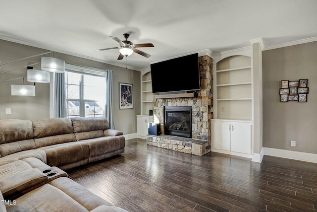 living room with crown molding, a fireplace, baseboards, and dark wood-style flooring