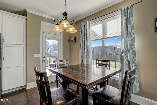 dining area featuring a wealth of natural light, dark wood-style flooring, crown molding, and baseboards