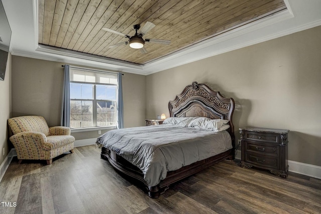 bedroom with wood ceiling, a tray ceiling, and crown molding