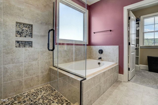 full bath with crown molding, a tile shower, a bath, and tile patterned floors