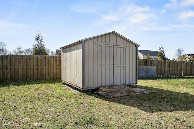 view of shed featuring a fenced backyard