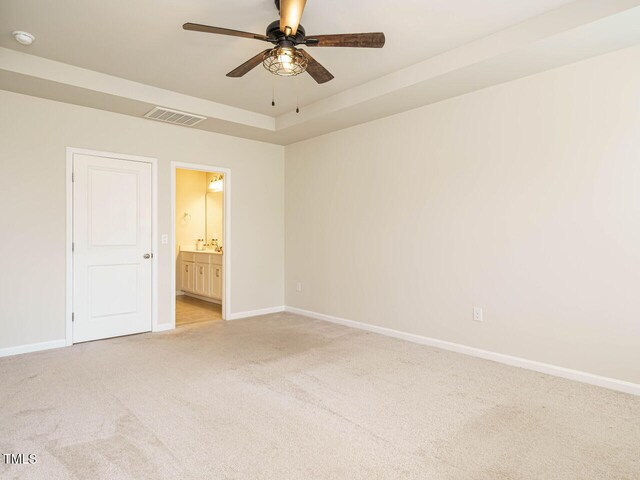 unfurnished room featuring light colored carpet, ceiling fan, baseboards, and a smoke detector