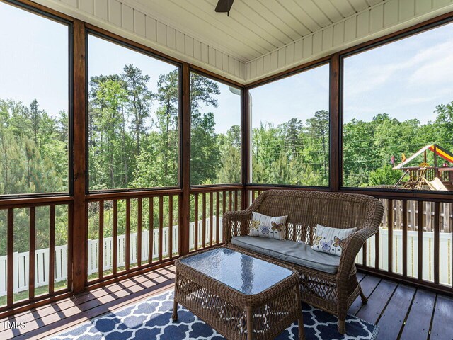 sunroom featuring a ceiling fan