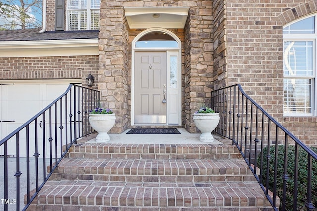 property entrance featuring brick siding