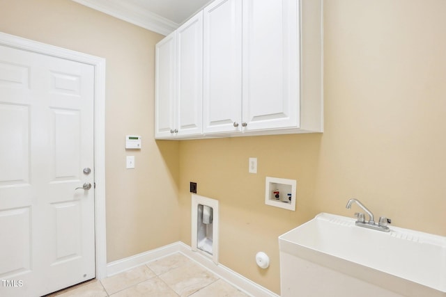 clothes washing area featuring baseboards, cabinet space, electric dryer hookup, washer hookup, and a sink