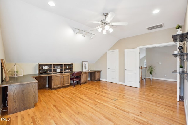 office area with visible vents, light wood-style flooring, baseboards, and lofted ceiling