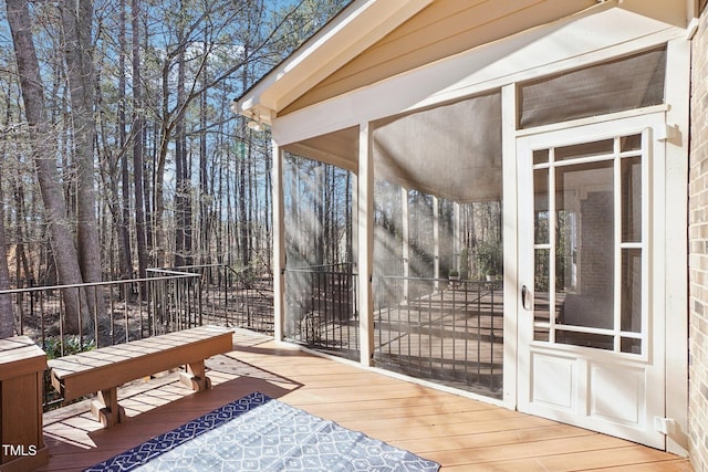 deck with a sunroom