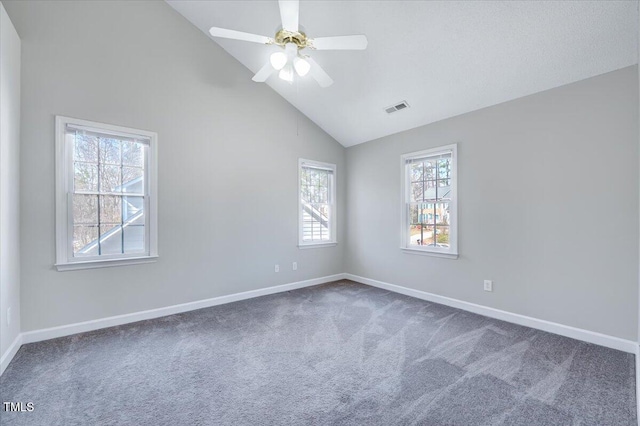 empty room featuring carpet floors, baseboards, visible vents, and a ceiling fan