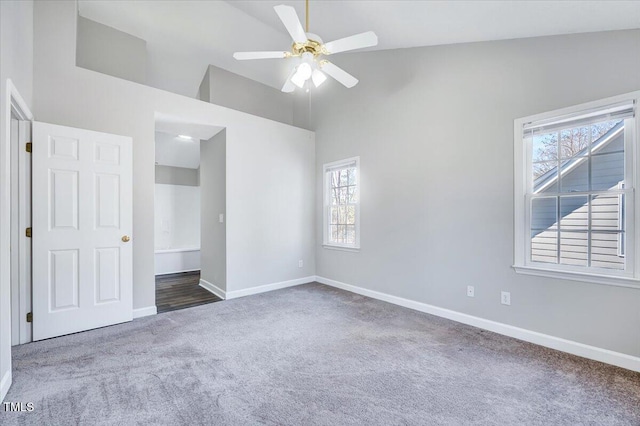 unfurnished bedroom featuring carpet floors, ceiling fan, high vaulted ceiling, and baseboards