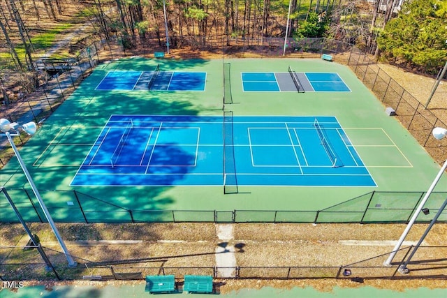 view of sport court with fence