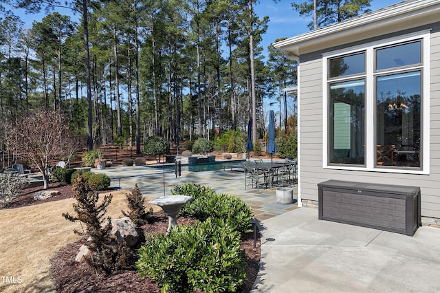 view of patio featuring a swimming pool