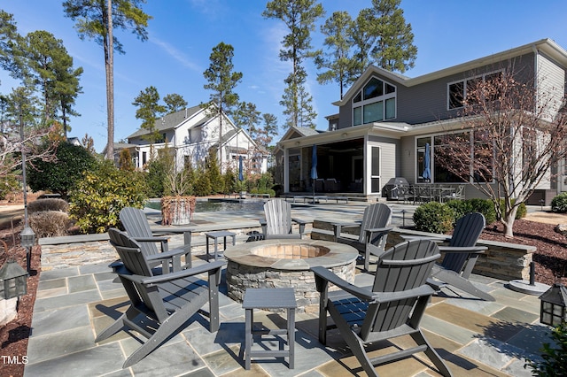 view of patio featuring a fire pit