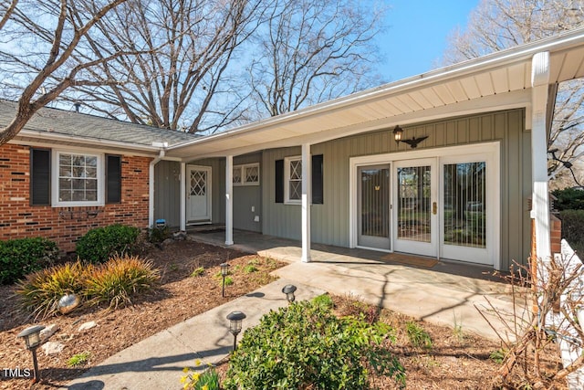 entrance to property with brick siding