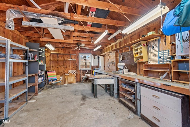 interior space featuring concrete floors and a workshop area