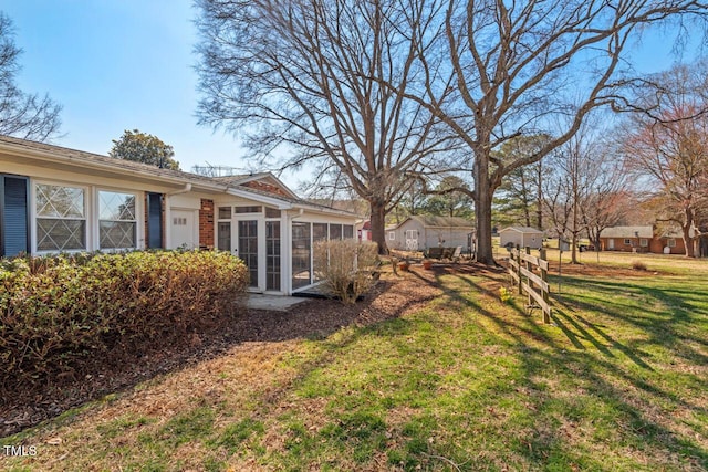 view of yard featuring a sunroom