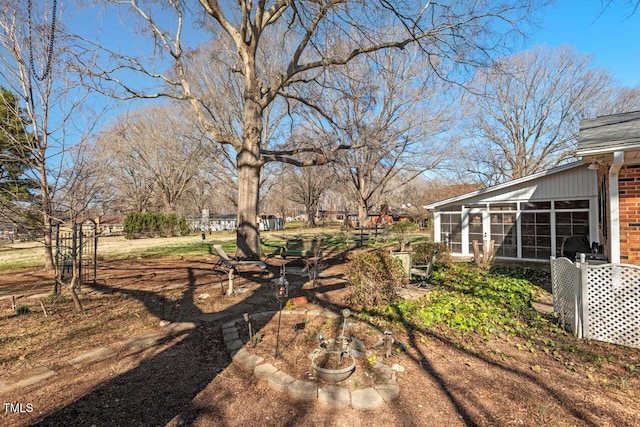 view of yard with a sunroom