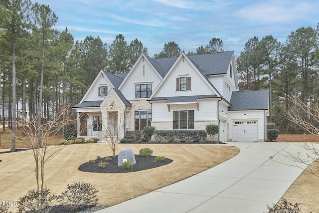 modern farmhouse style home featuring a garage, brick siding, a shingled roof, concrete driveway, and board and batten siding