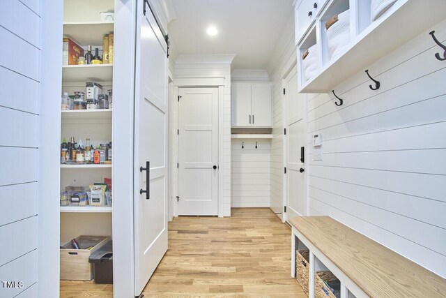 mudroom with light wood-style flooring