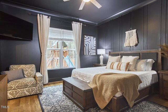 bedroom with light wood-style flooring and a ceiling fan