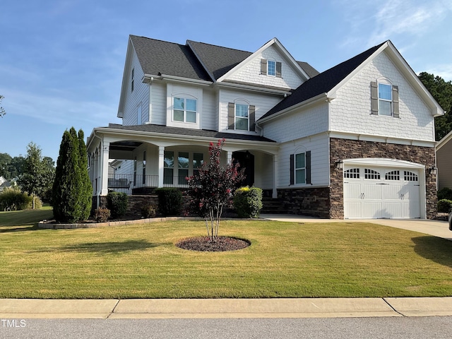 view of front of home with a garage, stone siding, concrete driveway, and a front yard