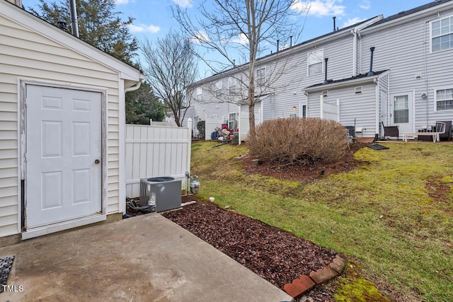 view of yard featuring a patio and central AC