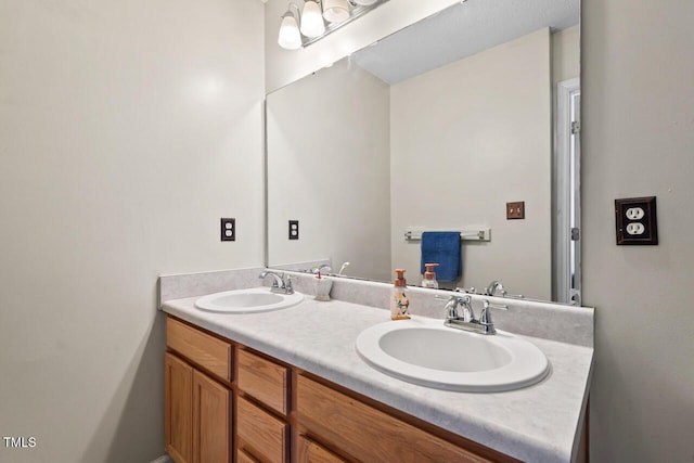 bathroom with double vanity and a sink