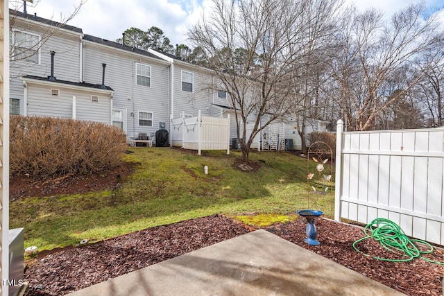 view of yard featuring a patio area and fence