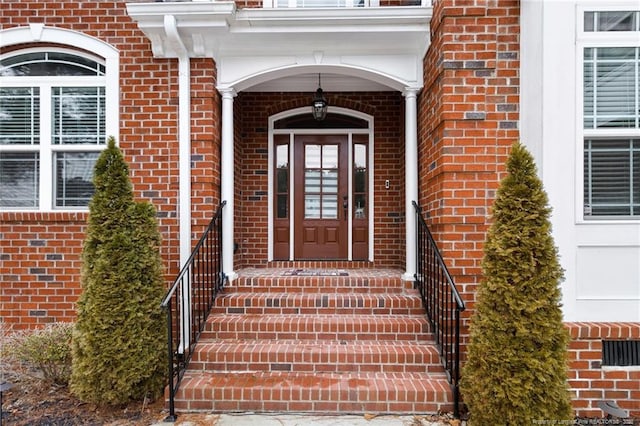 entrance to property with brick siding